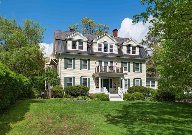 88 Round Hill Rd Unit 4, Northampton, MA 01060 - view of front of property with a balcony, a chimney, a front lawn, and a porch