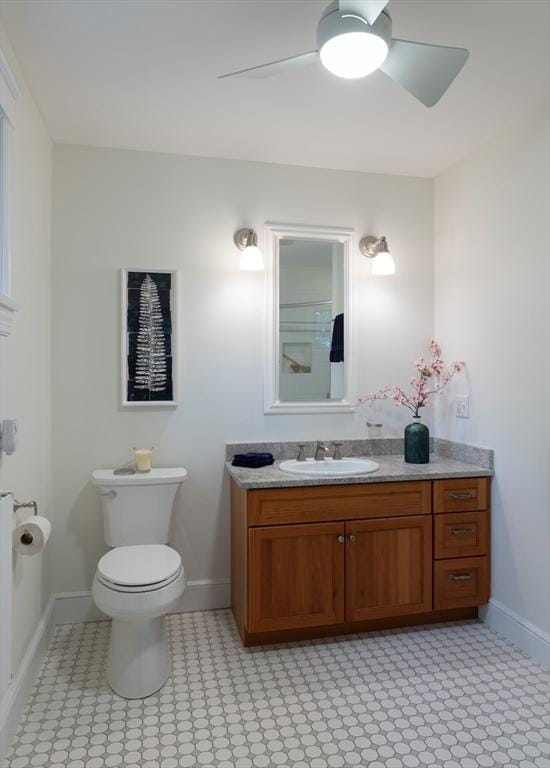 88 Round Hill Rd Unit 4, Northampton, MA 01060 - bathroom featuring a ceiling fan, baseboards, vanity, and toilet