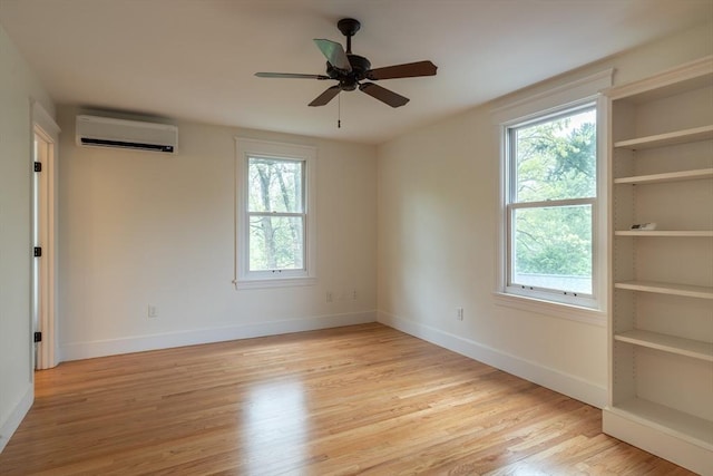 88 Round Hill Rd Unit 4, Northampton, MA 01060 - empty room with a wall mounted AC, light wood finished floors, baseboards, and ceiling fan