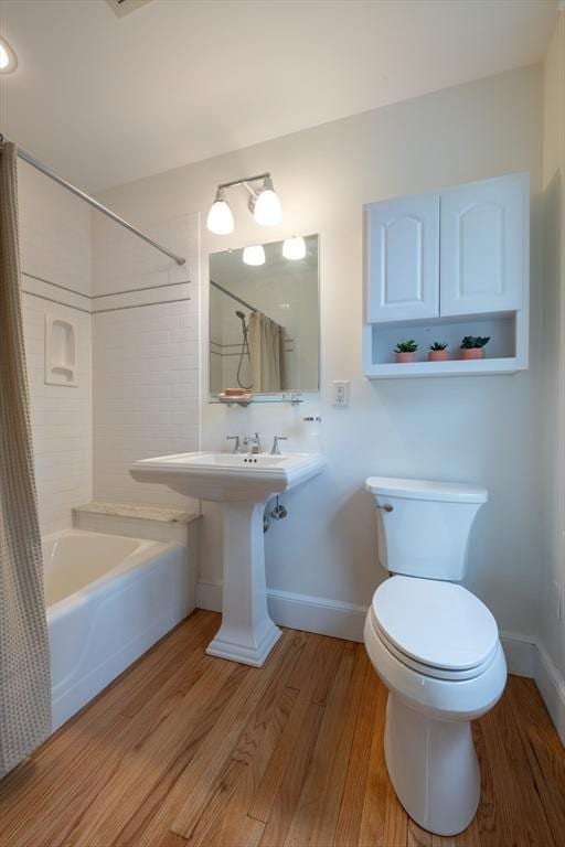 88 Round Hill Rd Unit 4, Northampton, MA 01060 - full bathroom featuring wood finished floors, toilet, baseboards, and shower / bath combo