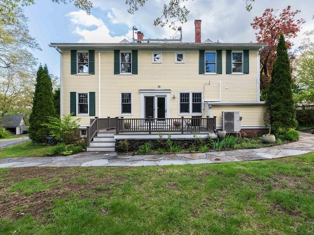 88 Round Hill Rd Unit 4, Northampton, MA 01060 - rear view of property with a deck, a chimney, and a lawn