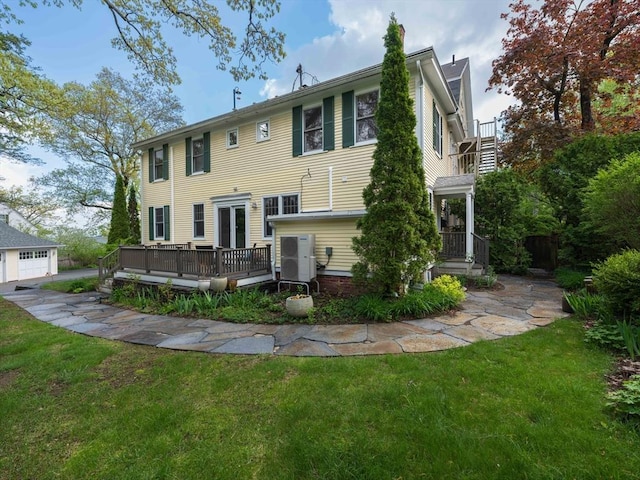 88 Round Hill Rd Unit 4, Northampton, MA 01060 - rear view of house with a lawn and a wooden deck