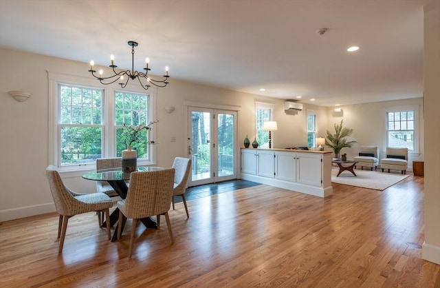 88 Round Hill Rd Unit 4, Northampton, MA 01060 - dining area featuring a chandelier, an AC wall unit, recessed lighting, light wood-style flooring, and baseboards