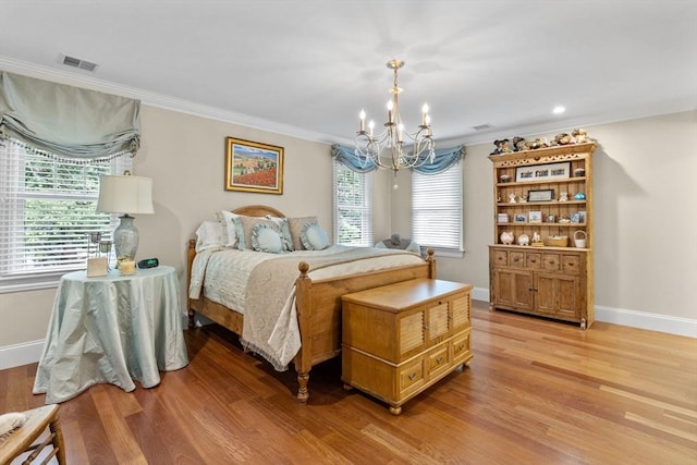 236 Grove St, Wellesley, MA 02482 - bedroom featuring a chandelier, light wood-style flooring, crown molding, and baseboards