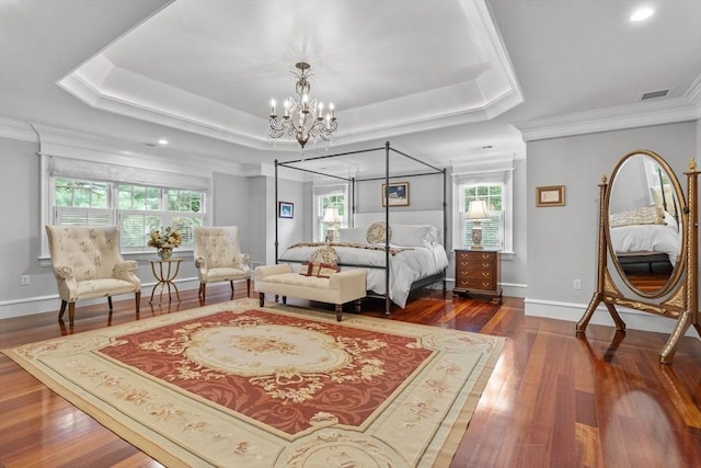 236 Grove St, Wellesley, MA 02482 - bedroom with a chandelier, a tray ceiling, wood finished floors, baseboards, and ornamental molding