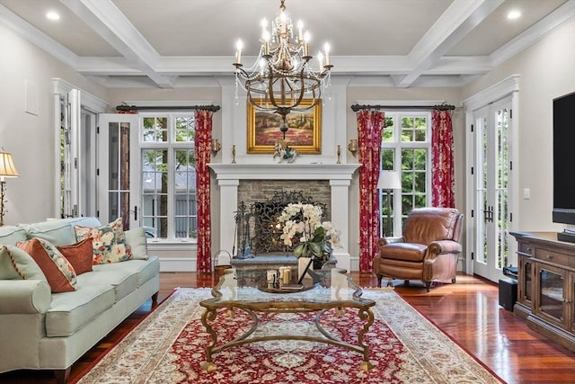 236 Grove St, Wellesley, MA 02482 - living room with dark wood finished floors, coffered ceiling, a warm lit fireplace, a chandelier, and beamed ceiling