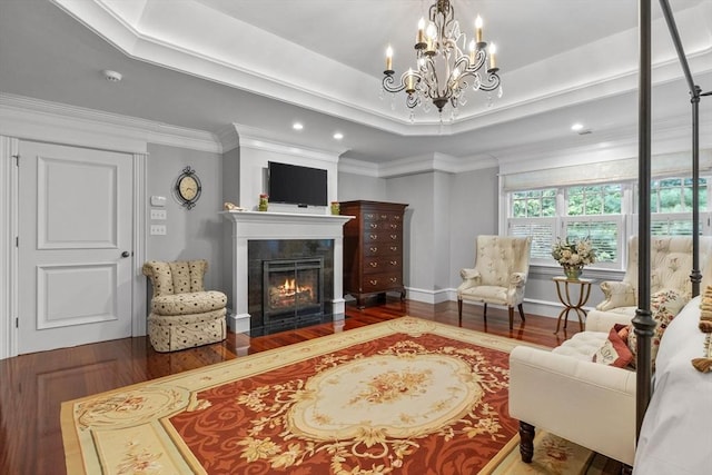 236 Grove St, Wellesley, MA 02482 - living room with wood finished floors, a chandelier, a tray ceiling, a tile fireplace, and recessed lighting