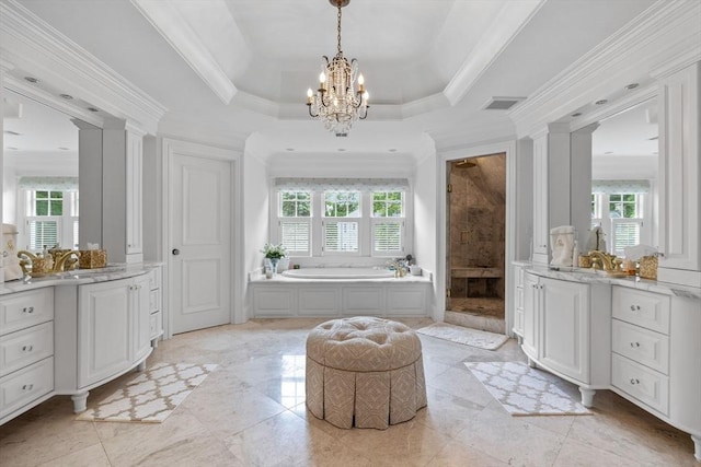 236 Grove St, Wellesley, MA 02482 - full bathroom with healthy amount of natural light, a bath, two vanities, a chandelier, and ornamental molding