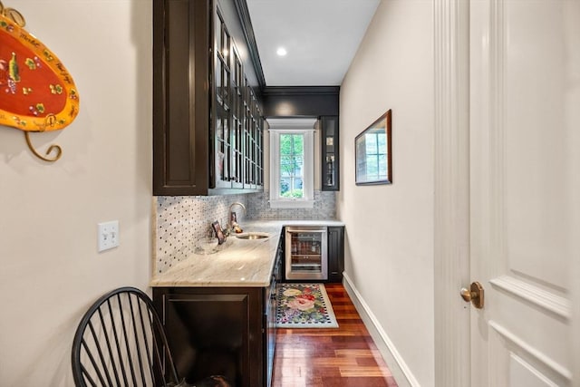 236 Grove St, Wellesley, MA 02482 - indoor wet bar featuring wine cooler, dark wood-style floors, tasteful backsplash, and baseboards