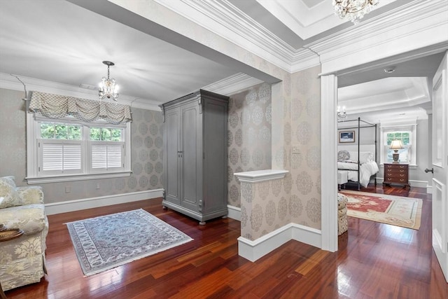 236 Grove St, Wellesley, MA 02482 - foyer featuring a chandelier, plenty of natural light, wood finished floors, wallpapered walls, and ornamental molding