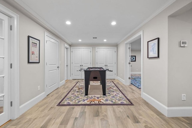 236 Grove St, Wellesley, MA 02482 - rec room with crown molding, baseboards, light wood-style flooring, and recessed lighting