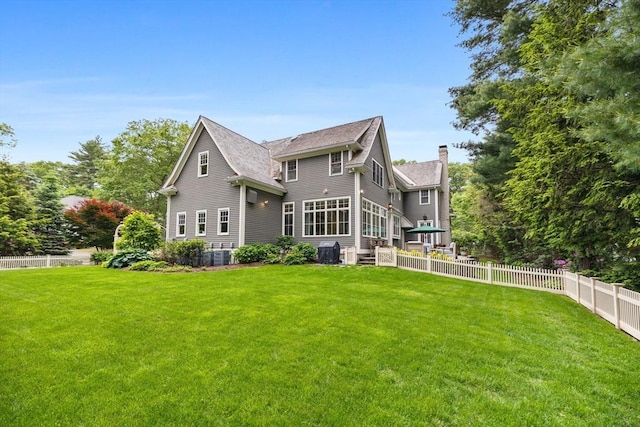 236 Grove St, Wellesley, MA 02482 - rear view of property with a chimney, roof with shingles, and central AC