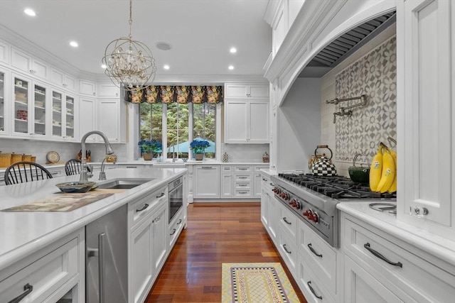 236 Grove St, Wellesley, MA 02482 - kitchen featuring stainless steel gas stovetop, white cabinets, light countertops, and recessed lighting