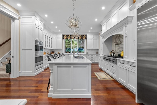 236 Grove St, Wellesley, MA 02482 - kitchen with stainless steel appliances, a sink, light countertops, white cabinets, and recessed lighting