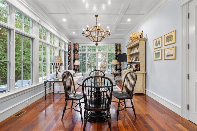 236 Grove St, Wellesley, MA 02482 - dining area featuring plenty of natural light, coffered ceiling, ornamental molding, dark wood-style floors, and a chandelier