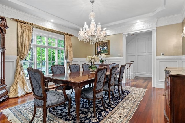 236 Grove St, Wellesley, MA 02482 - dining room with a decorative wall, a chandelier, ornamental molding, wainscoting, and dark wood-type flooring