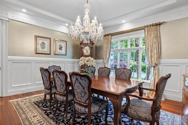 236 Grove St, Wellesley, MA 02482 - dining space featuring a chandelier, a decorative wall, wainscoting, wood finished floors, and ornamental molding