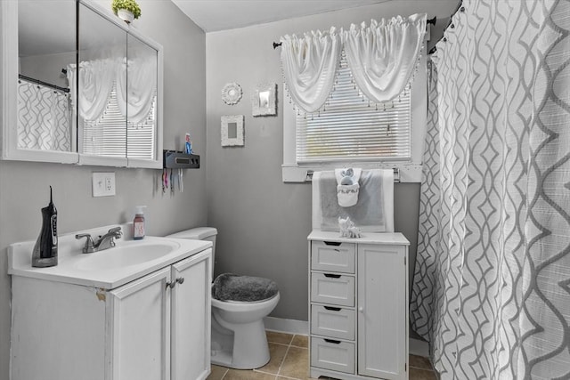 full bath featuring vanity, a shower with shower curtain, tile patterned flooring, and toilet