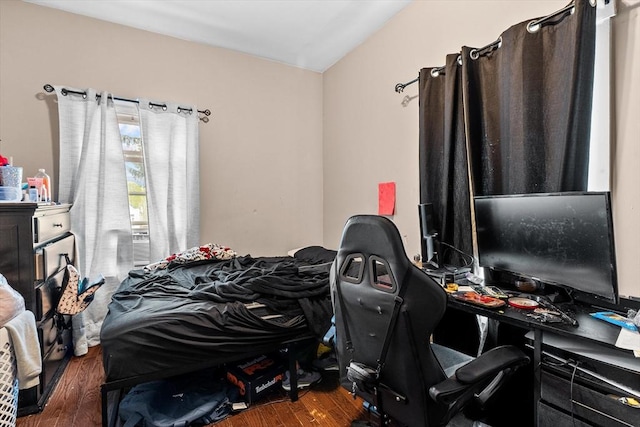 bedroom featuring wood finished floors