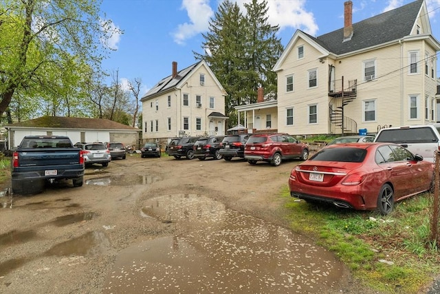 uncovered parking lot featuring stairs