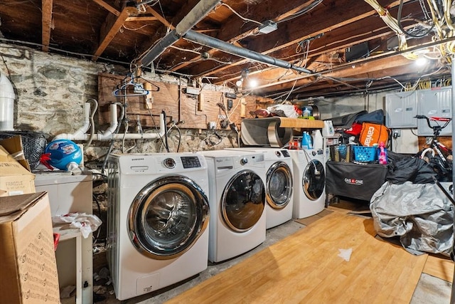 clothes washing area with laundry area, washer and clothes dryer, and electric panel
