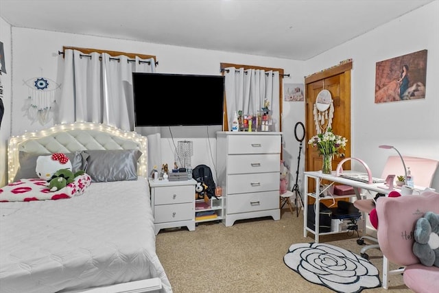 bedroom featuring light colored carpet