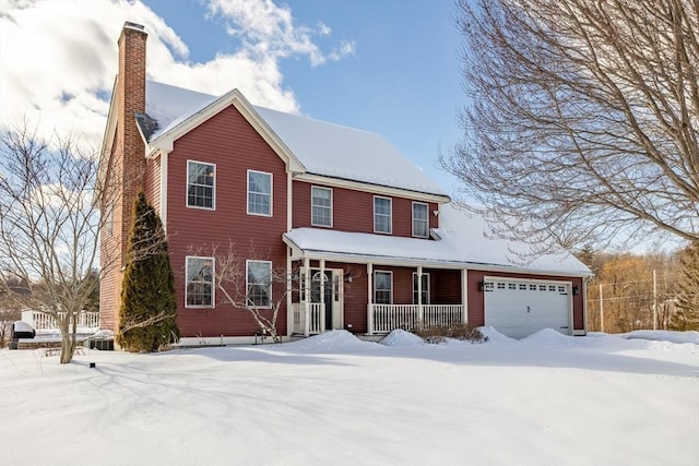 view of front of property featuring a garage, covered porch, and a chimney