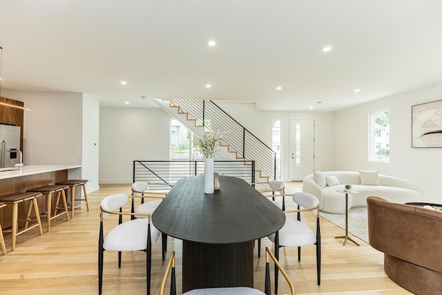 95 Griswold St Unit 95, Cambridge, MA 02139 - dining space featuring light wood-style flooring, recessed lighting, stairs, and baseboards