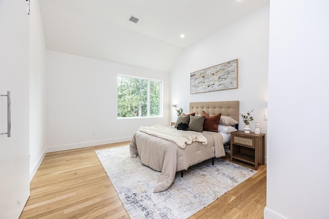 95 Griswold St Unit 95, Cambridge, MA 02139 - bedroom with light wood-style floors, vaulted ceiling, baseboards, and recessed lighting