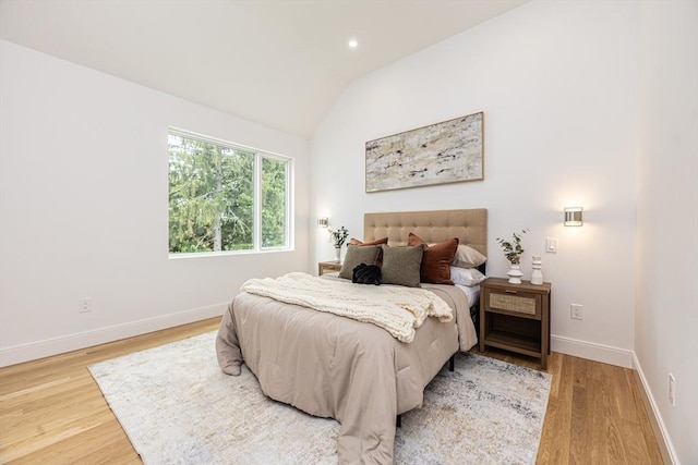 95 Griswold St Unit 95, Cambridge, MA 02139 - bedroom with wood finished floors, vaulted ceiling, and baseboards