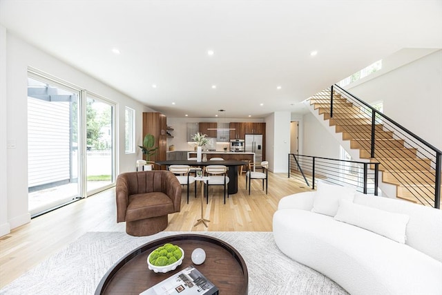 95 Griswold St Unit 95, Cambridge, MA 02139 - living room featuring light wood-style flooring, stairway, and recessed lighting