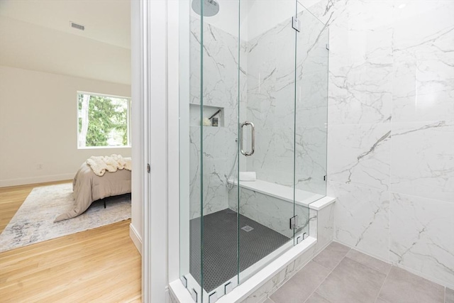 95 Griswold St Unit 95, Cambridge, MA 02139 - ensuite bathroom with a marble finish shower and wood finished floors