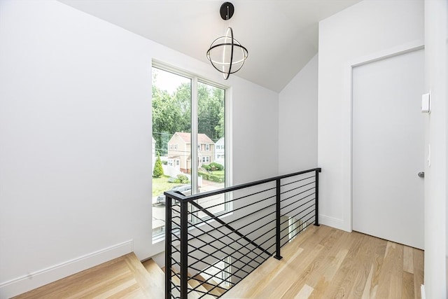 95 Griswold St Unit 95, Cambridge, MA 02139 - stairs featuring wood finished floors, lofted ceiling, and baseboards