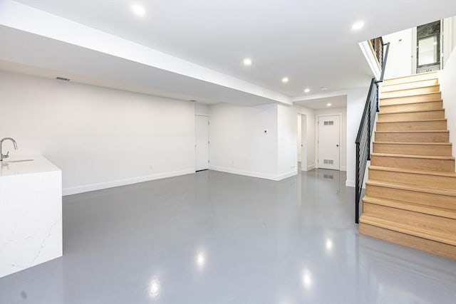 95 Griswold St Unit 95, Cambridge, MA 02139 - finished basement featuring stairs, recessed lighting, a sink, and baseboards
