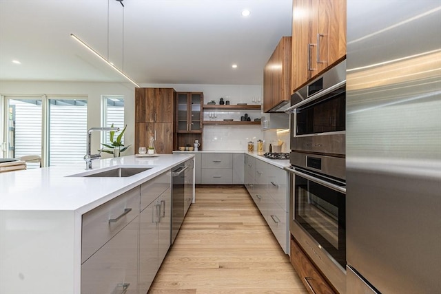 95 Griswold St Unit 95, Cambridge, MA 02139 - kitchen featuring appliances with stainless steel finishes, modern cabinets, a sink, open shelves, and gray cabinets