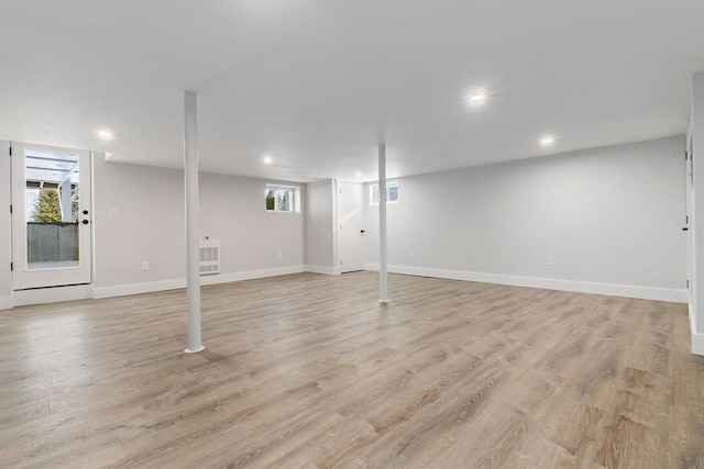 basement featuring light wood-type flooring