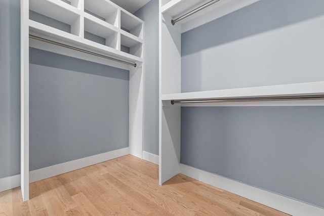 walk in closet featuring hardwood / wood-style floors