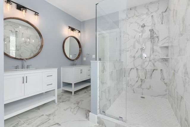 bathroom featuring tiled shower and vanity