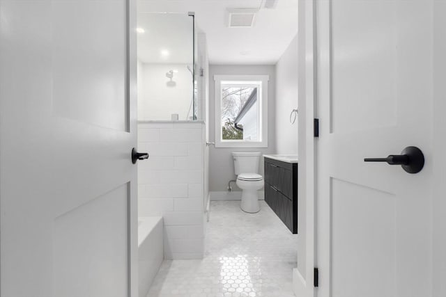 bathroom with vanity, tile patterned flooring, and toilet