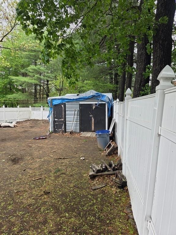 view of shed with fence