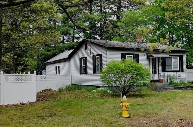 view of front of house featuring a chimney