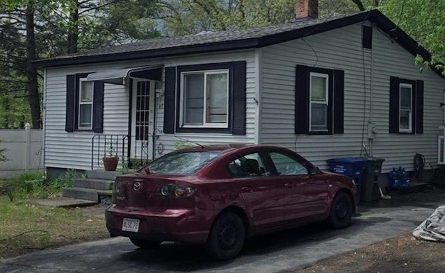 single story home with a chimney