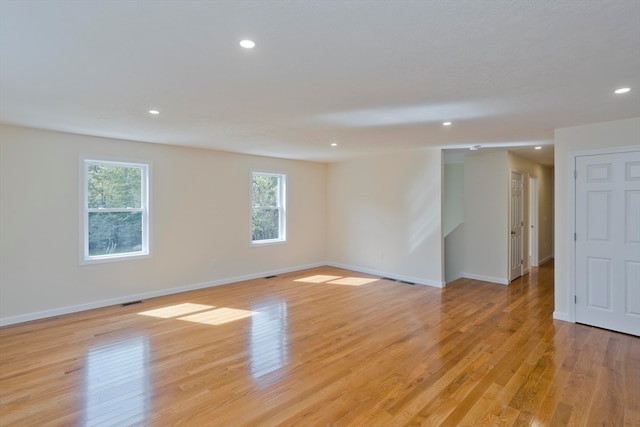 spare room with light wood-type flooring