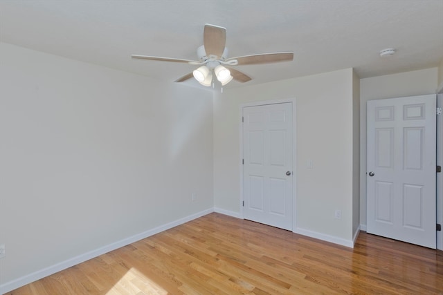 unfurnished bedroom with ceiling fan, light hardwood / wood-style flooring, and a closet