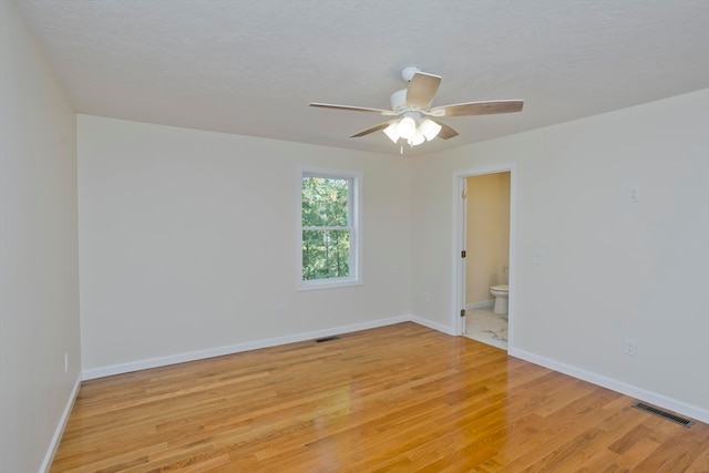 unfurnished room with light hardwood / wood-style floors and ceiling fan