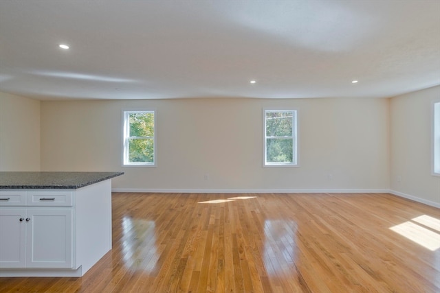 unfurnished living room featuring light hardwood / wood-style flooring