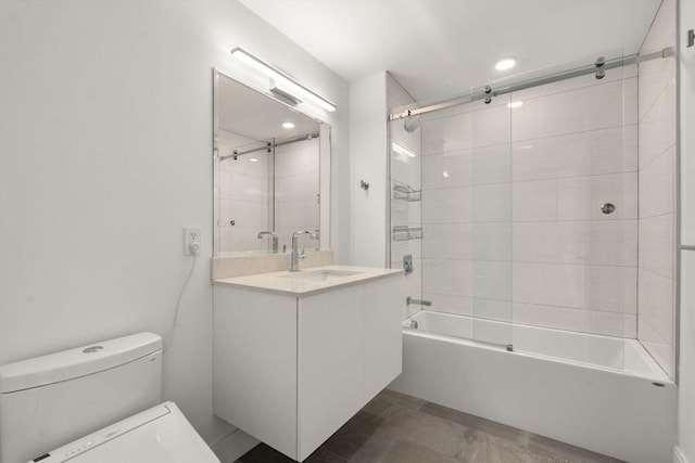 bathroom with toilet, shower / bathing tub combination, and vanity