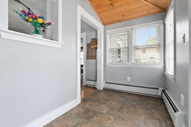 10 Saunders Rd, Lynn, MA 01904 - spare room featuring a baseboard radiator, stone finish floors, baseboard heating, wooden ceiling, and vaulted ceiling