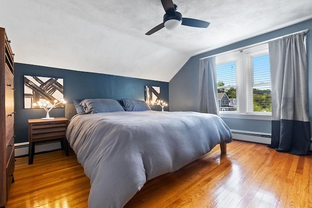 10 Saunders Rd, Lynn, MA 01904 - bedroom featuring a baseboard heating unit, vaulted ceiling, hardwood / wood-style flooring, and a ceiling fan
