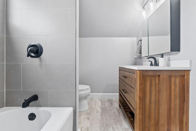 10 Saunders Rd, Lynn, MA 01904 - bathroom featuring vanity, wood finished floors, and tub / shower combination